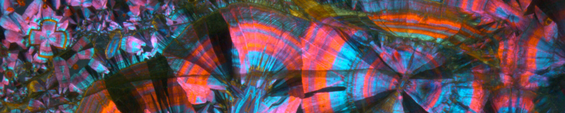 Epigenetic inclusion (probanly melanterite) in quartz, Brazil, crossed polarisers