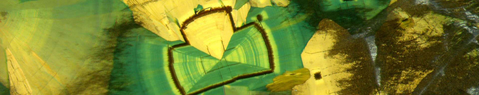 Epigenetic inclusion (probanly melanterite) in quartz, Brazil, parallel polarisers